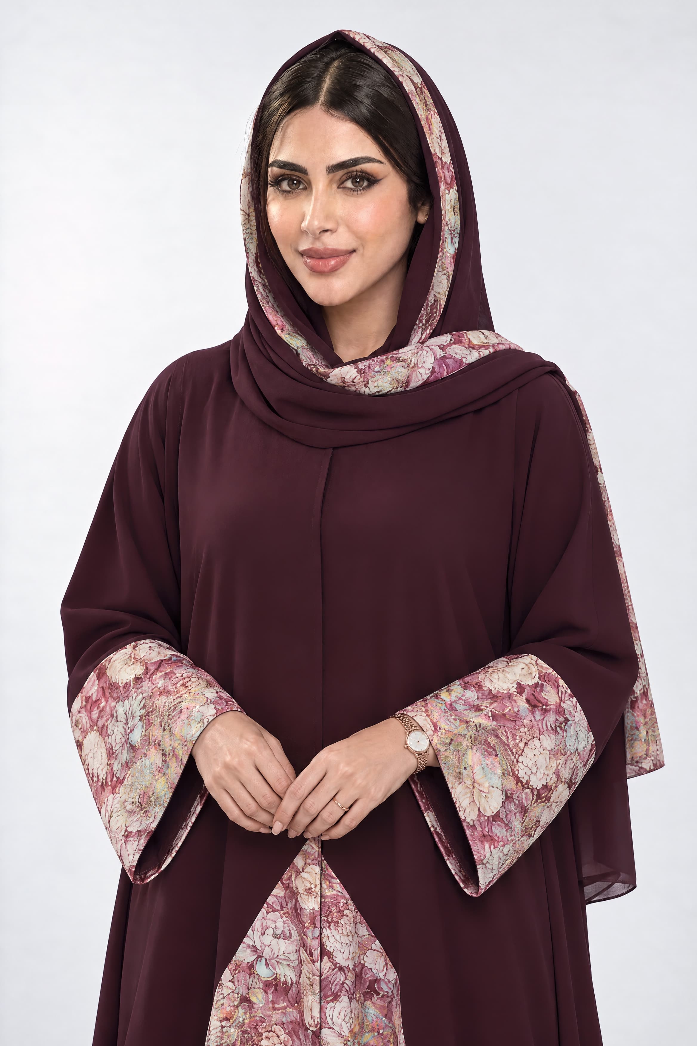 Maroon crepe abaya with details at the sleeves, scarf, and back.
