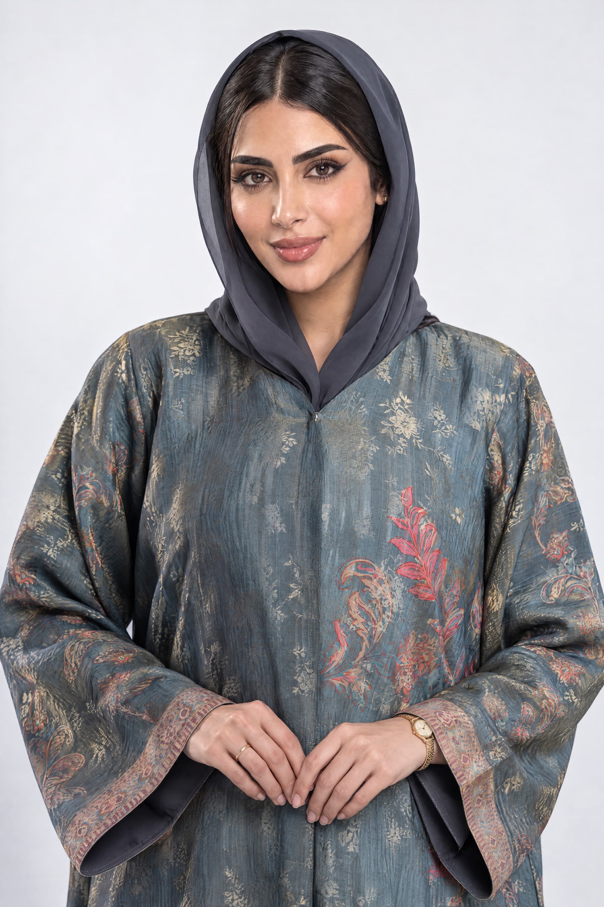 Grey and gold organza abaya with a matching scarf.